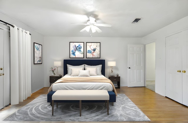 24011 Lone Elm Dr, Spring, TX 77373 - bedroom with light wood-type flooring, ceiling fan, and baseboards