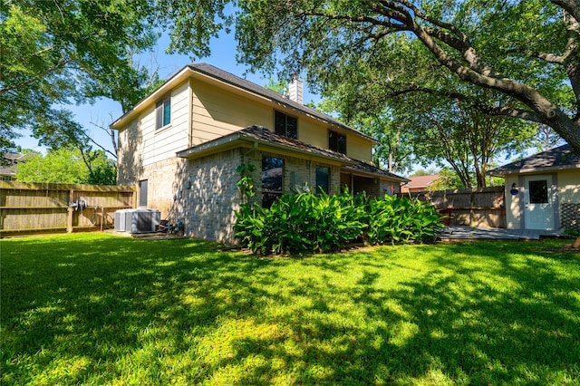 16526 Battlecreek Dr, Houston, TX 77095 - back of property with a chimney, stone siding, and cooling unit