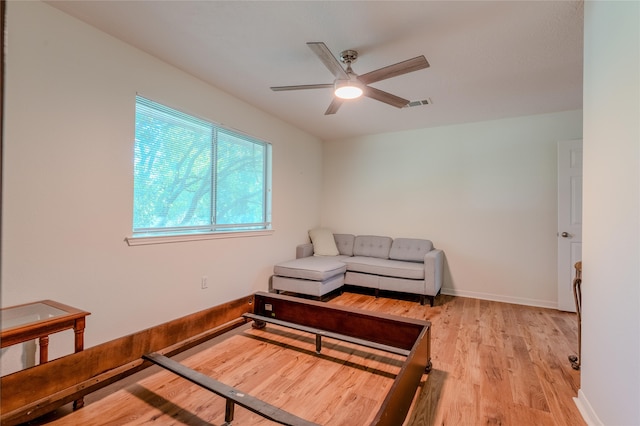 16526 Battlecreek Dr, Houston, TX 77095 - living area featuring light wood-style floors, a ceiling fan, and baseboards