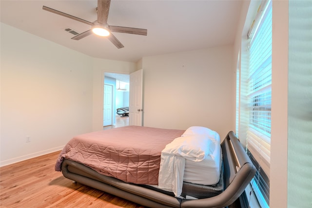 16526 Battlecreek Dr, Houston, TX 77095 - bedroom with wood finished floors, baseboards, and a ceiling fan