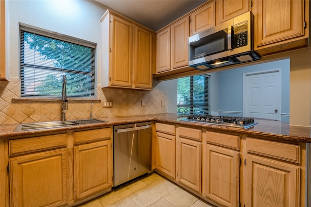 16526 Battlecreek Dr, Houston, TX 77095 - kitchen with appliances with stainless steel finishes, a sink, tasteful backsplash, and light tile patterned floors