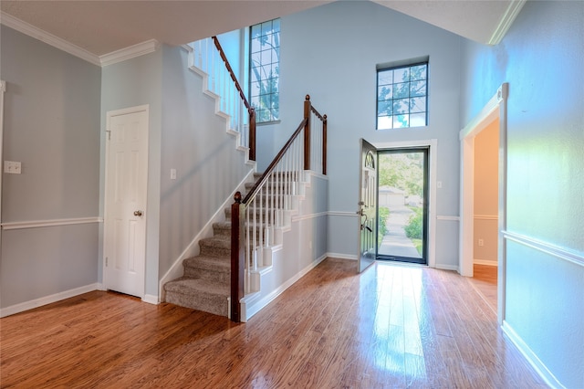 16526 Battlecreek Dr, Houston, TX 77095 - foyer entrance featuring stairway, wood finished floors, ornamental molding, and baseboards