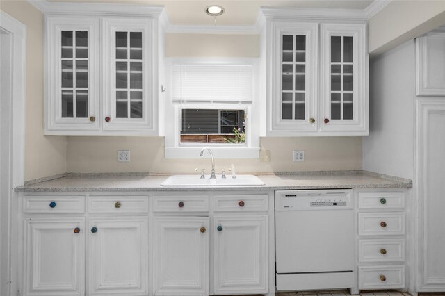 kitchen with white dishwasher, a sink, white cabinetry, glass insert cabinets, and crown molding