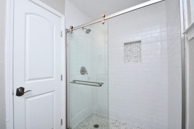 full bath with a shower stall