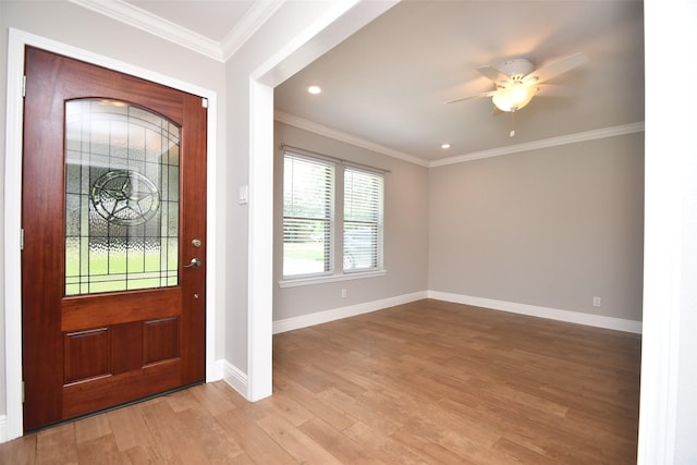 entrance foyer with baseboards, light wood-style floors, a ceiling fan, crown molding, and recessed lighting