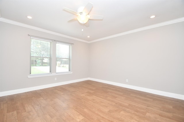 spare room with baseboards, ceiling fan, light wood finished floors, crown molding, and recessed lighting