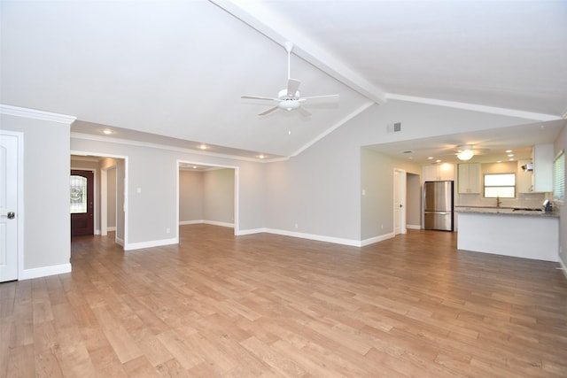 unfurnished living room featuring ceiling fan, recessed lighting, light wood finished floors, and healthy amount of natural light