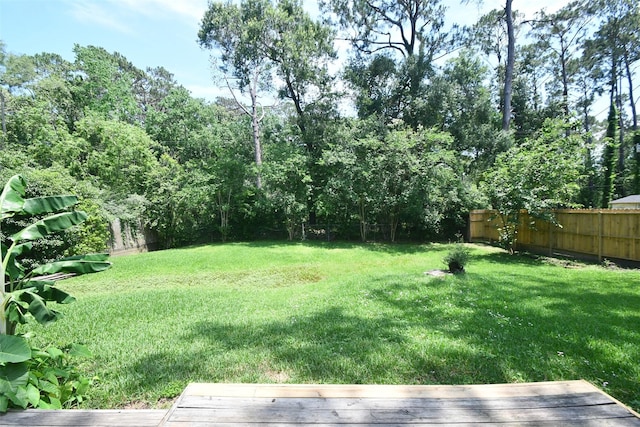 view of yard featuring a wooden deck