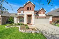 18230 Russett Green Dr, Tomball, TX 77377 - view of front facade featuring concrete driveway and a front lawn