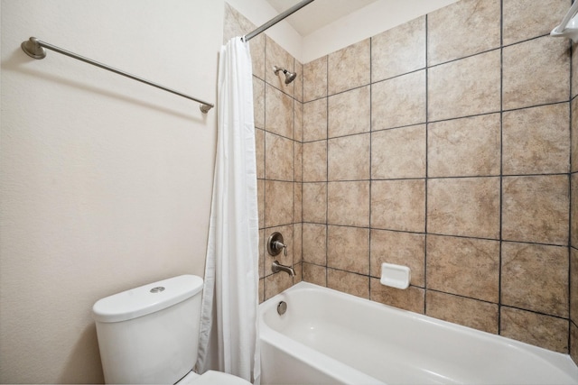 18230 Russett Green Dr, Tomball, TX 77377 - bathroom featuring shower / bath combo with shower curtain and toilet
