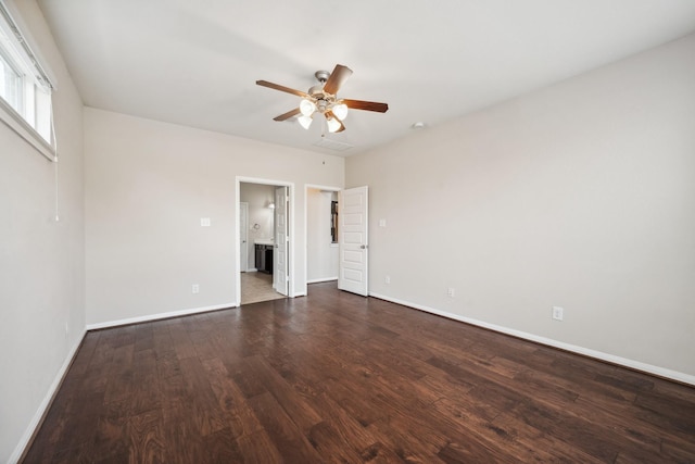 18230 Russett Green Dr, Tomball, TX 77377 - unfurnished bedroom featuring wood finished floors, baseboards, ensuite bathroom, and ceiling fan