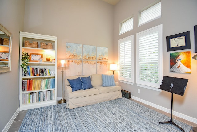 5006 Isidore Ln, Missouri City, TX 77459 - sitting room featuring tile patterned floors, a high ceiling, and baseboards