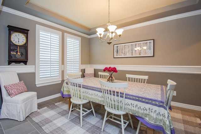 5006 Isidore Ln, Missouri City, TX 77459 - tiled dining area with a chandelier, ornamental molding, baseboards, and a tray ceiling