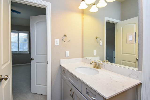 5006 Isidore Ln, Missouri City, TX 77459 - bathroom with a chandelier and vanity