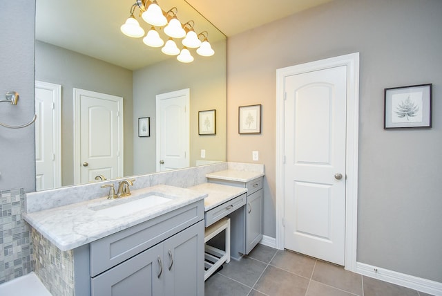 5006 Isidore Ln, Missouri City, TX 77459 - bathroom with tile patterned flooring, vanity, baseboards, and a chandelier