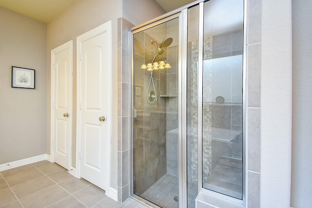 5006 Isidore Ln, Missouri City, TX 77459 - full bathroom with a shower stall, tile patterned flooring, and baseboards