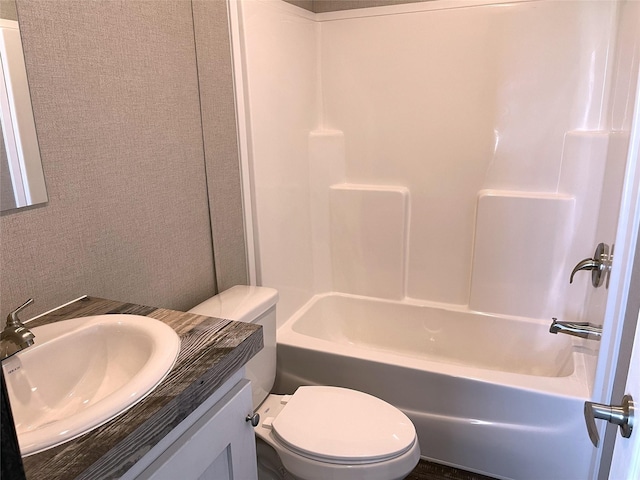 322 E College St, Fairfield, TX 75840 - bathroom featuring toilet, vanity, and bathing tub / shower combination