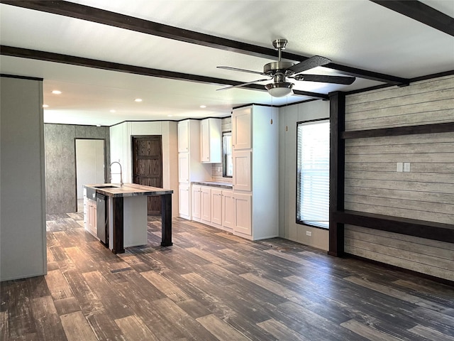 322 E College St, Fairfield, TX 75840 - kitchen with beamed ceiling, white cabinets, ceiling fan, dark wood finished floors, and recessed lighting