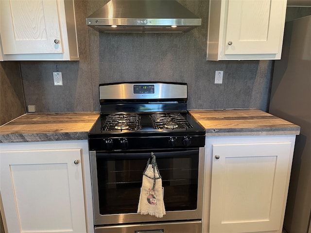 322 E College St, Fairfield, TX 75840 - kitchen with exhaust hood, stainless steel appliances, butcher block countertops, and decorative backsplash