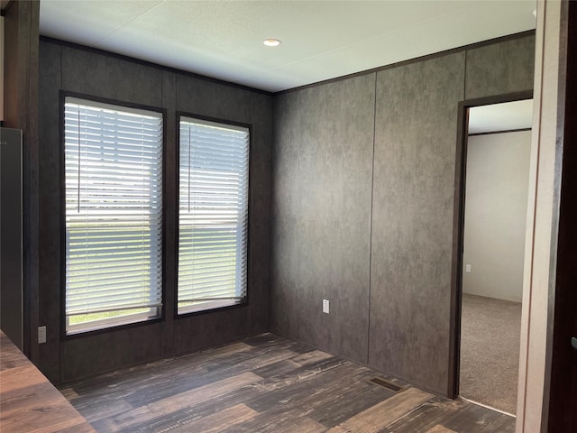322 E College St, Fairfield, TX 75840 - spare room with dark wood-style floors