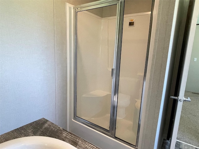 322 E College St, Fairfield, TX 75840 - full bath with a stall shower and a textured wall