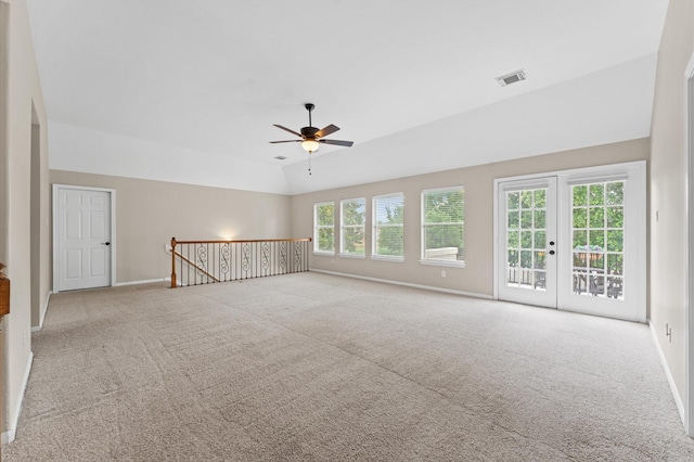 carpeted empty room featuring ceiling fan and baseboards