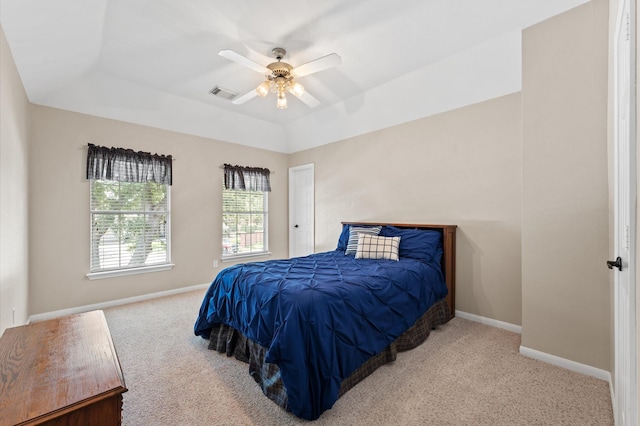 carpeted bedroom with baseboards and a ceiling fan