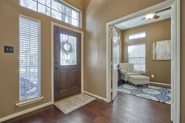 70 Harvest Wind Pl, The Woodlands, TX 77382 - entryway featuring healthy amount of natural light, baseboards, ceiling fan, and dark wood-type flooring