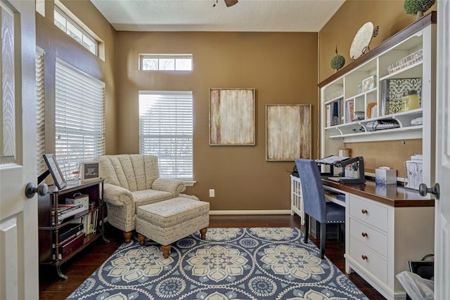 70 Harvest Wind Pl, The Woodlands, TX 77382 - home office featuring built in study area, dark wood-style floors, baseboards, and a ceiling fan