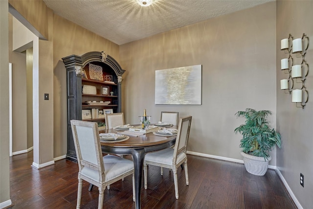 70 Harvest Wind Pl, The Woodlands, TX 77382 - dining space with wood-type flooring, baseboards, and a textured ceiling