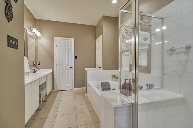 70 Harvest Wind Pl, The Woodlands, TX 77382 - full bath with a garden tub, a stall shower, tile patterned flooring, double vanity, and baseboards