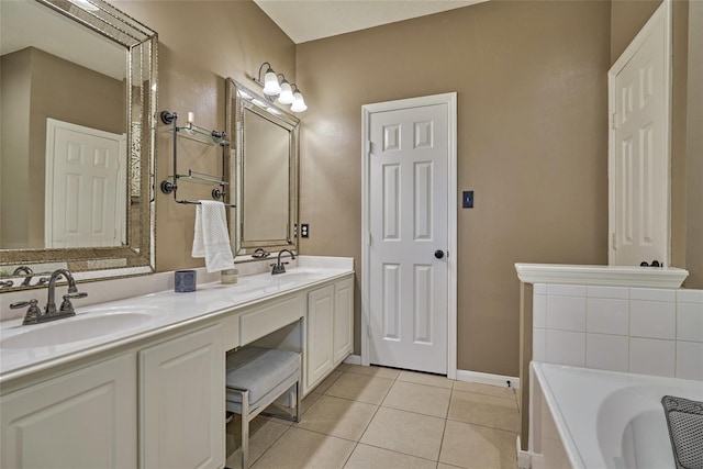 70 Harvest Wind Pl, The Woodlands, TX 77382 - bathroom with tile patterned flooring, a tub to relax in, double vanity, and baseboards