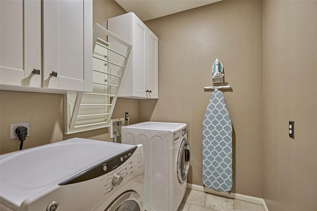 70 Harvest Wind Pl, The Woodlands, TX 77382 - washroom featuring washing machine and dryer, cabinet space, baseboards, and light tile patterned floors