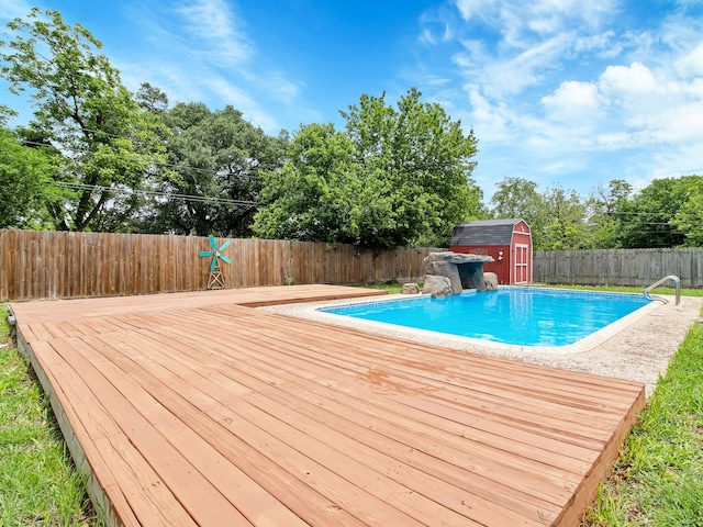507 Patricia, San Antonio, TX 78216 - view of pool with a storage unit, a fenced backyard, a wooden deck, an outdoor structure, and view of wooded area