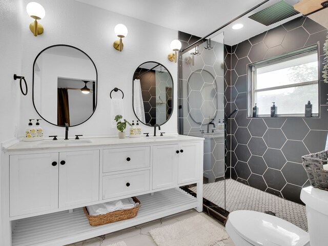 507 Patricia, San Antonio, TX 78216 - bathroom with toilet, tiled shower, double vanity, and tile walls
