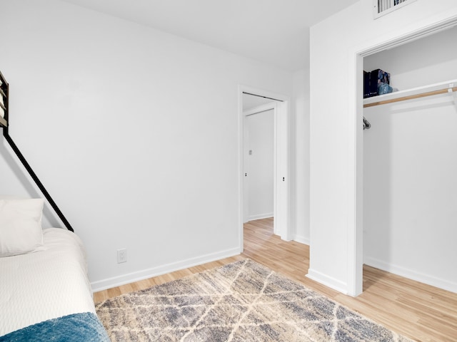 507 Patricia, San Antonio, TX 78216 - unfurnished bedroom with light wood-type flooring, a closet, and baseboards