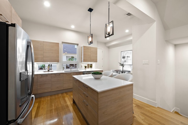 2705 St Emanuel St, Houston, TX 77004 - kitchen featuring appliances with stainless steel finishes, modern cabinets, a sink, a kitchen island, and recessed lighting