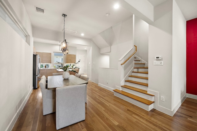 2705 St Emanuel St, Houston, TX 77004 - dining room with wood finished floors, baseboards, stairway, and recessed lighting