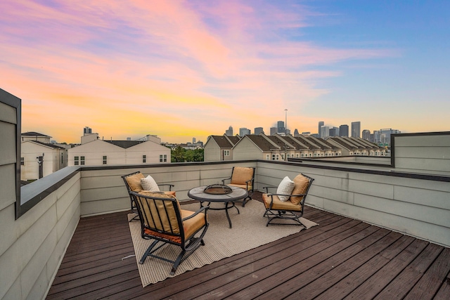 2705 St Emanuel St, Houston, TX 77004 - deck at dusk with an outdoor fire pit