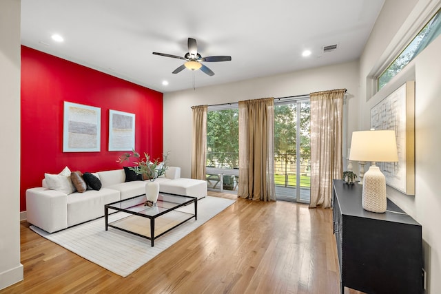 2705 St Emanuel St, Houston, TX 77004 - living area featuring light wood-type flooring, ceiling fan, healthy amount of natural light, and recessed lighting