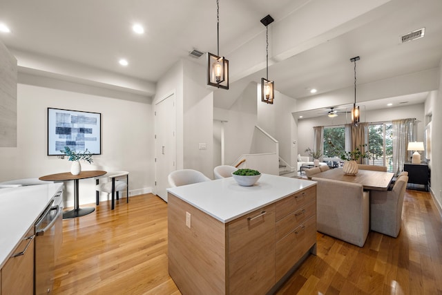 2705 St Emanuel St, Houston, TX 77004 - kitchen featuring a center island, light wood-type flooring, ceiling fan, modern cabinets, and recessed lighting