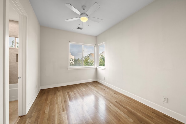 2705 St Emanuel St, Houston, TX 77004 - unfurnished room featuring healthy amount of natural light, wood finished floors, baseboards, and ceiling fan
