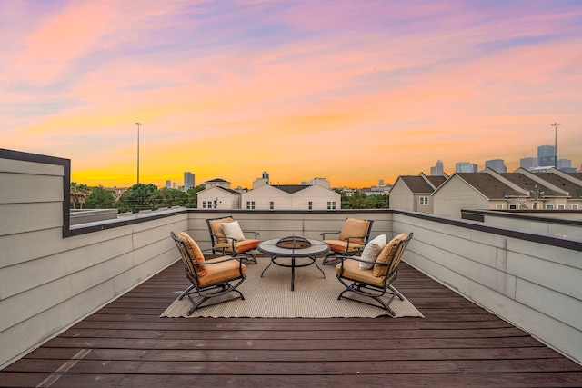 2705 St Emanuel St, Houston, TX 77004 - deck at dusk with a fire pit