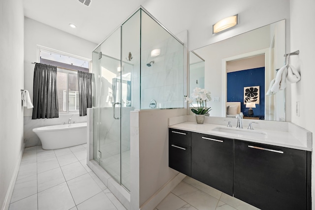 2705 St Emanuel St, Houston, TX 77004 - ensuite bathroom featuring a freestanding bath, vanity, a stall shower, and baseboards