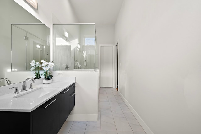 2705 St Emanuel St, Houston, TX 77004 - full bathroom featuring vanity, a shower with door, marble look tiles, and baseboards