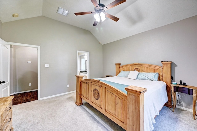 923 Garrett Dr, Magnolia, TX 77354 - bedroom with light carpet, lofted ceiling, baseboards, a ceiling fan, and ensuite bath