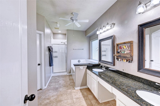 923 Garrett Dr, Magnolia, TX 77354 - full bath with a stall shower, double vanity, a bath, a ceiling fan, and tile patterned floors