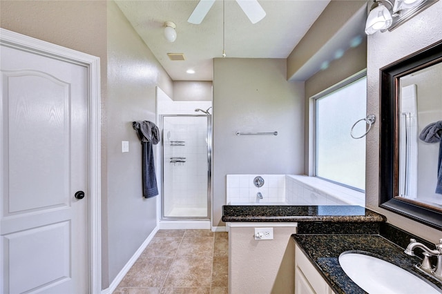 923 Garrett Dr, Magnolia, TX 77354 - full bath with a stall shower, vanity, ceiling fan, and tile patterned floors