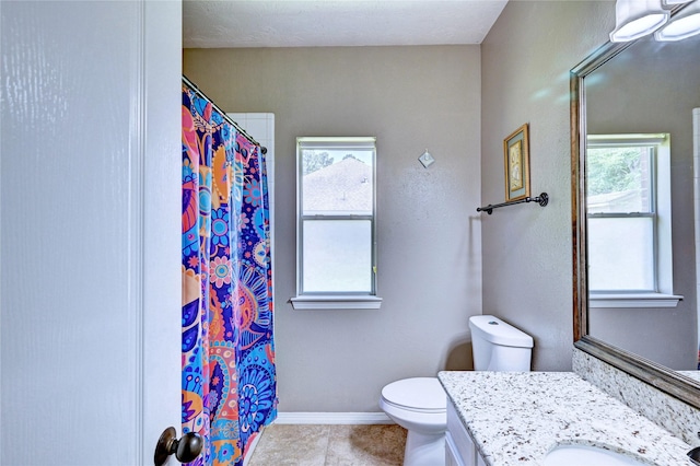 923 Garrett Dr, Magnolia, TX 77354 - bathroom with vanity, toilet, tile patterned flooring, baseboards, and a shower with curtain