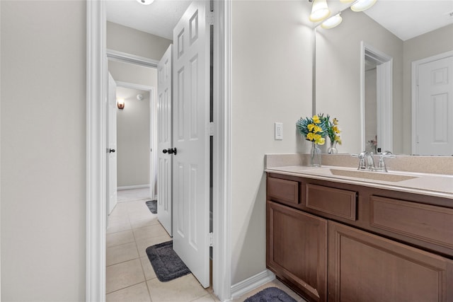 22726 Little Blue Stem Dr, Tomball, TX 77375 - bathroom with tile patterned flooring, vanity, and baseboards